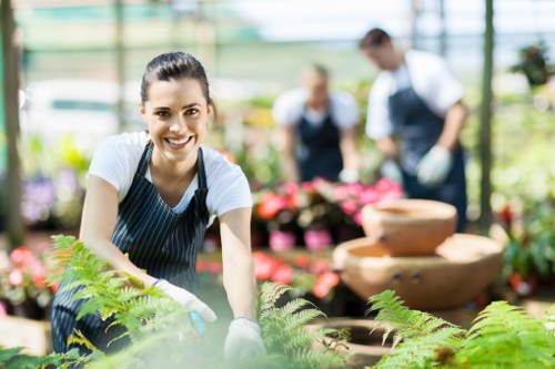 Team applying safe gardening practices while maintaining a tidy work area